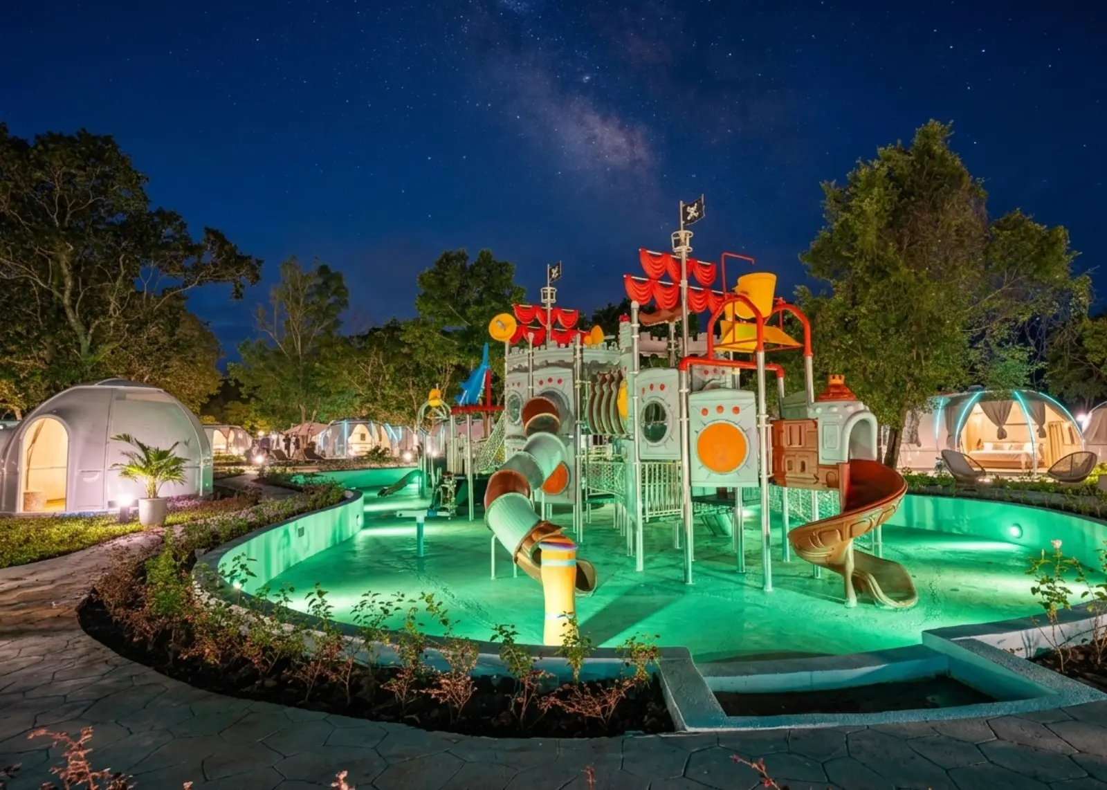Outdoor swimming pool with water slides at Bidong View Resort